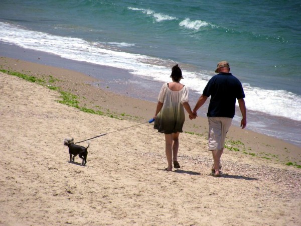 Mediterranean Sea-Beach-couple walk hand in hand
