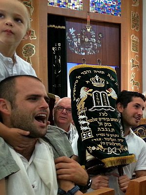 Holding one of 11 sacred Torah scrolls in a Tel Aviv synagogue this morning on Simchat Torah