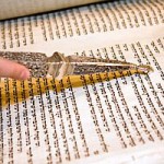 Reading from the Torah scroll with a yad