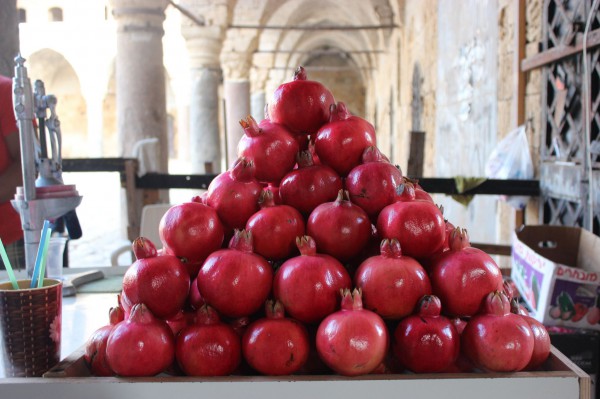 A juice stand in Israel with a tantalizing display of pomegranates.