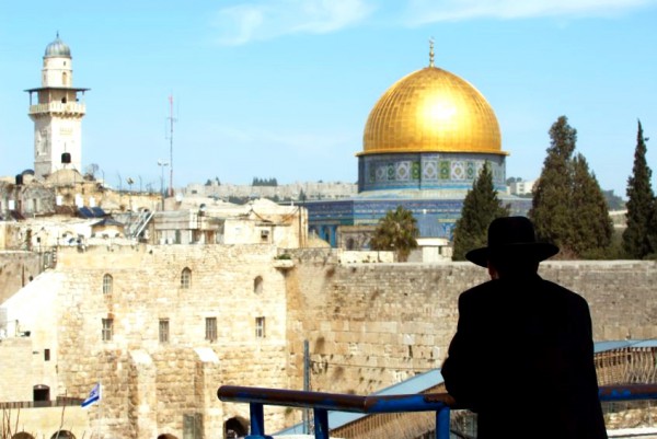 An Orthodox Jewish man looks out over the Western Wall Plaza in the Old City of Jerusalem.