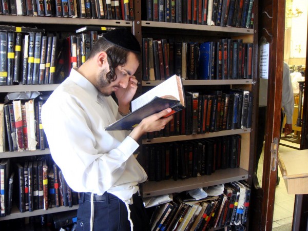 A Jewish man studies at a Yeshiva (Orthodox Jewish seminary) in Jerusalem.