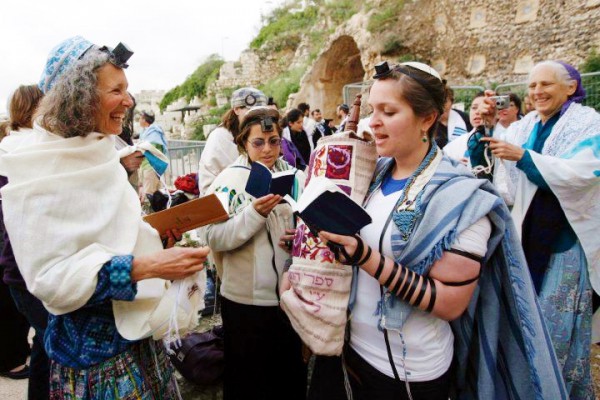 Women of the Wall praying and reading Torah at their monthly Rosh Chodesh (new moon, literally head of the new [month]) service.