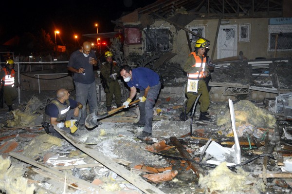 Crews clean up after Hamas rocket smash Israeli home