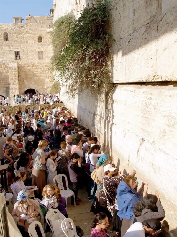 Jewish women pray at the Western (Wailing) Wall in Jerusalem. The Wall was part of the retaining structure that supported the Temple Mount. Of the four walls, the Western Wall is thought to be the closest to the spot where the Temple was located. While the Temple Mount is Judaism's holiest site, the Western Wall is Judaism's second, deriving its holiness from the Mount itself.