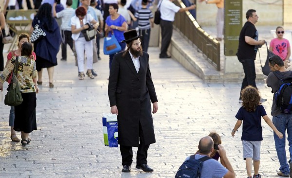 An ultra-Orthodox Jewish man on his way to pray at the Kotel (Western Wall).