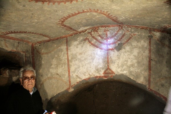 A menorah in the Jewish catacombs of Rome (Photo by Context Travel)