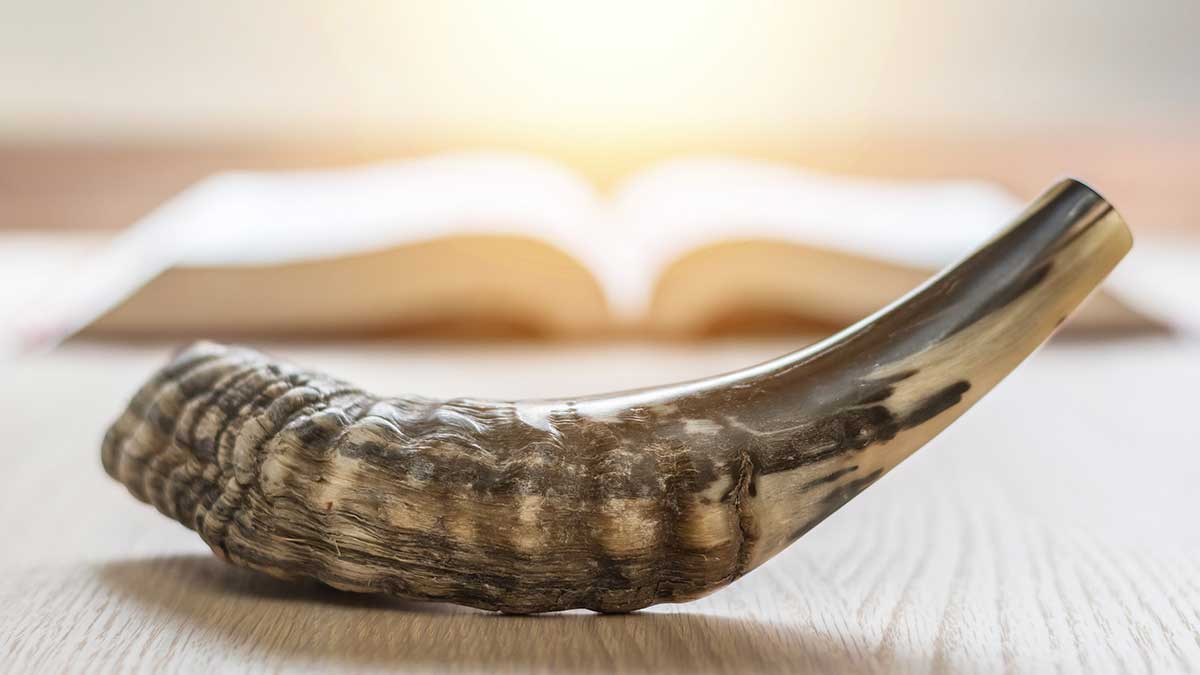 Shofar, ram' horn, in front of Bible